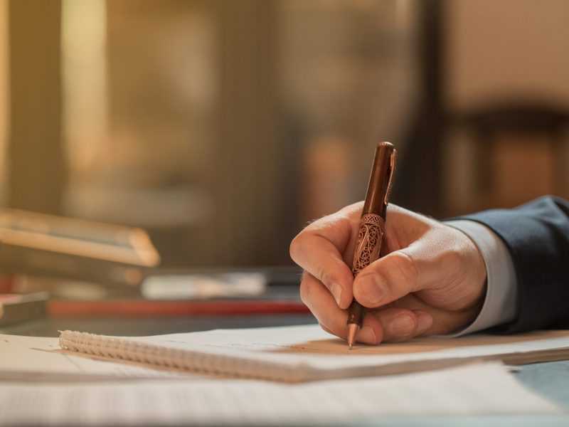 Director signing documents with a fashion pen. High quality photo